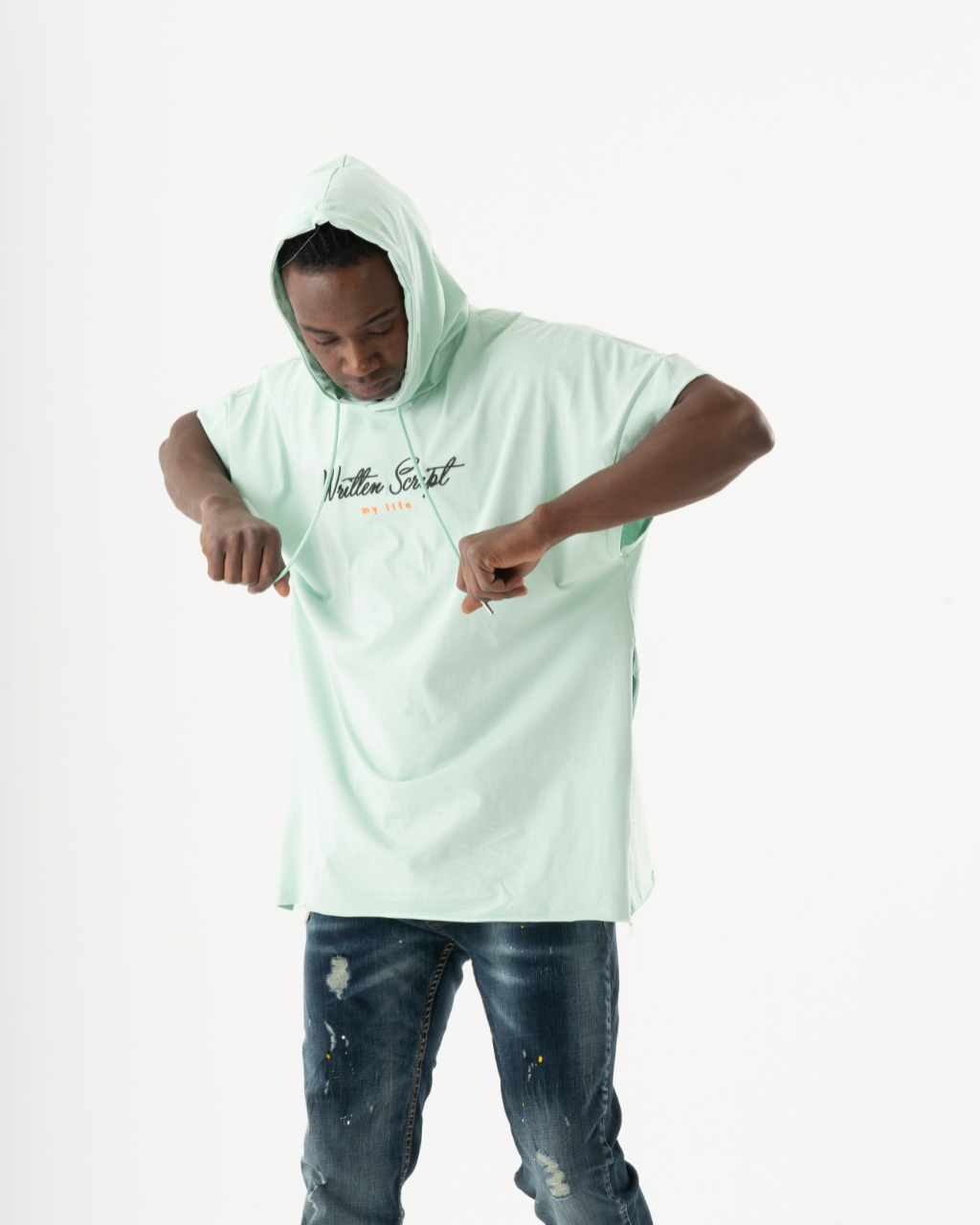 A man wearing an EXPLORER HOODIE and jeans with a soft feel.