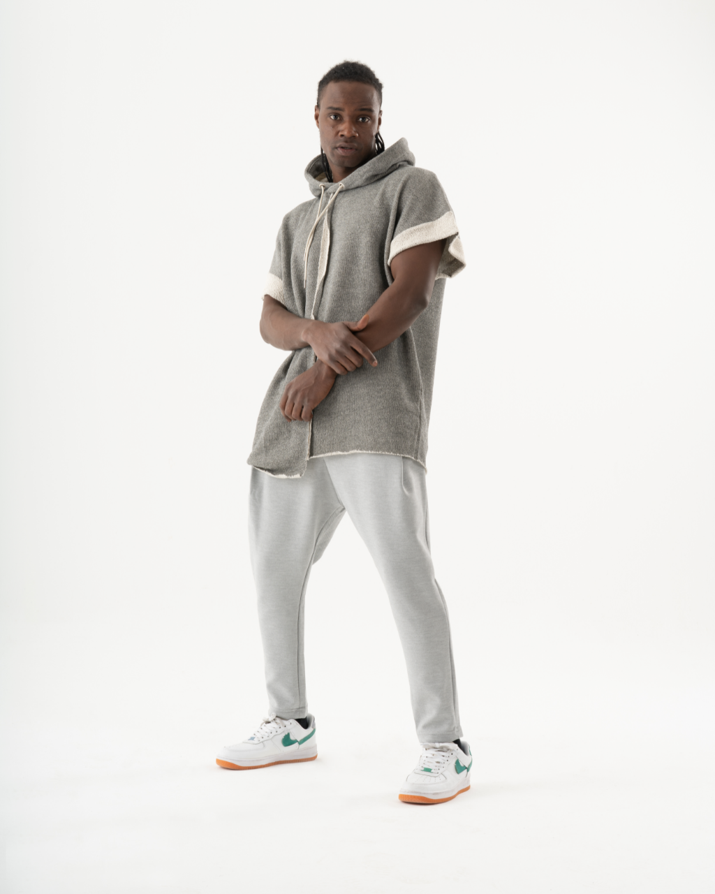 A man in a HAILMARY HOODIE posing in front of a white background.