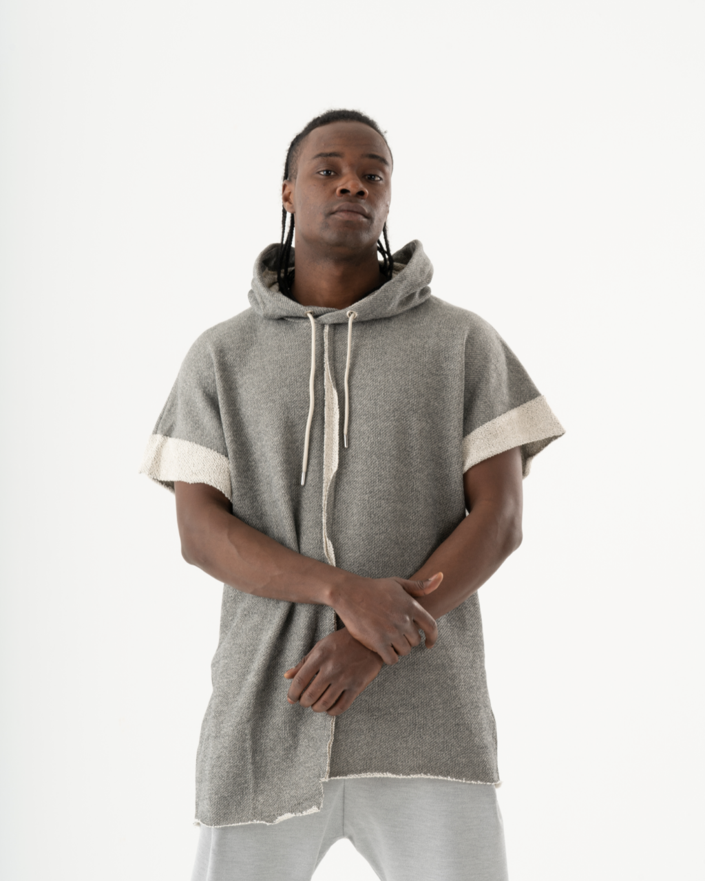 A man wearing a HAILMARY HOODIE.