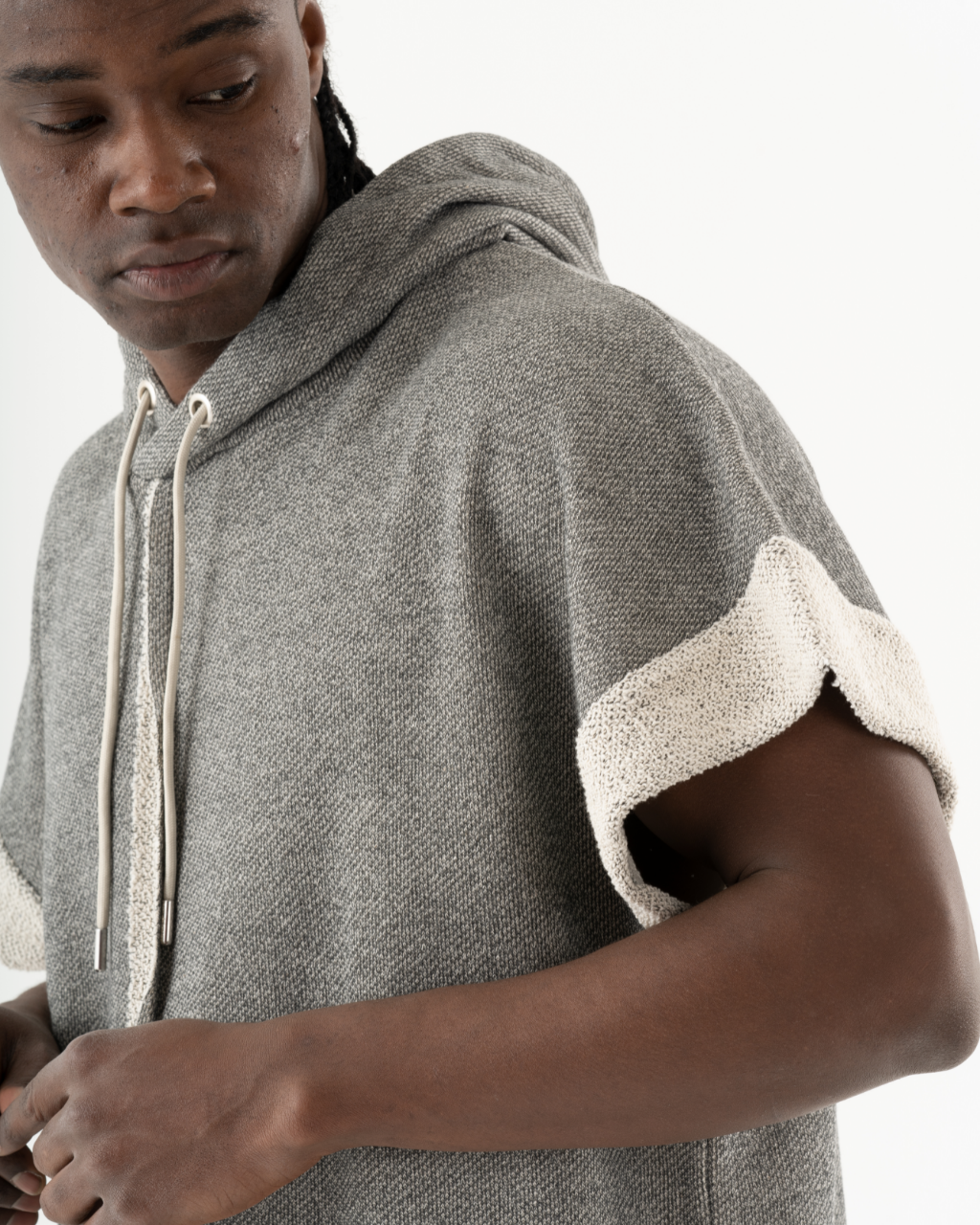 A man wearing a comfortable HAILMARY HOODIE.