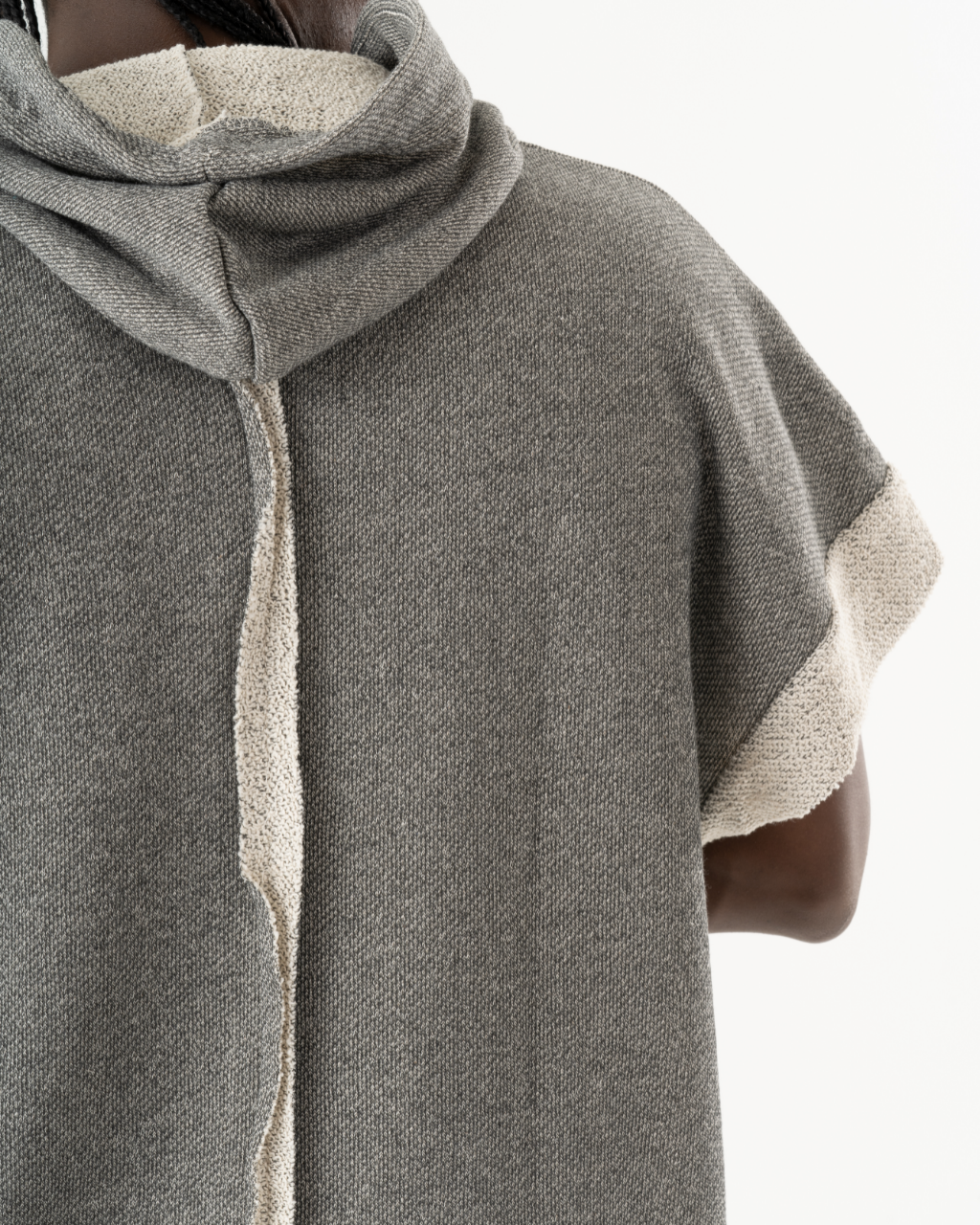 The back view of a woman wearing a HAILMARY HOODIE.