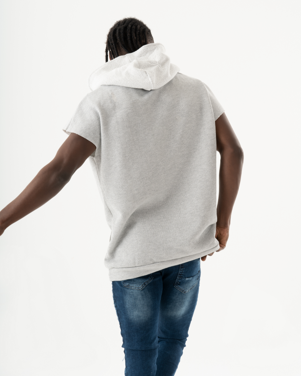 A man wearing a BACHELOR HOODIE | WHITE and jeans.
