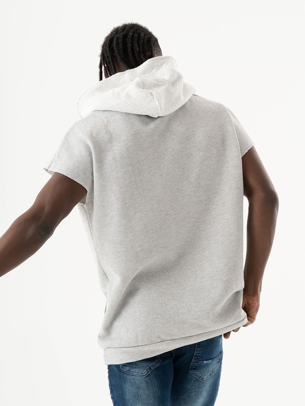 A man wearing a BACHELOR HOODIE | WHITE and jeans.