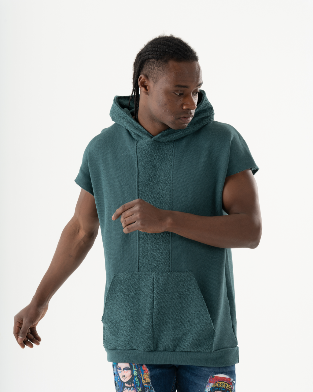 A man wearing a BACHELOR HOODIE | GREEN with a pouch pocket.