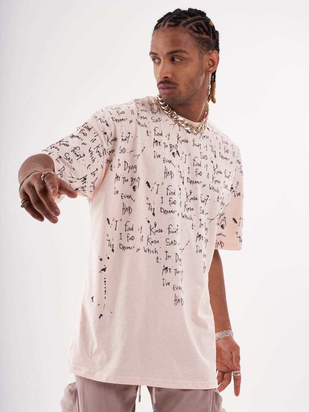 A man wearing a THINKER T-SHIRT with writing on it.