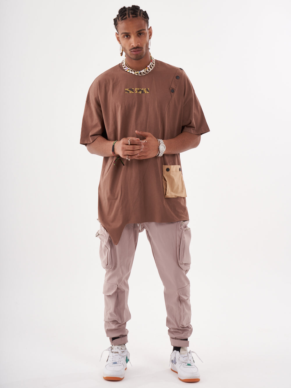 A man wearing a BEATNIK T-SHIRT and cargo pants.