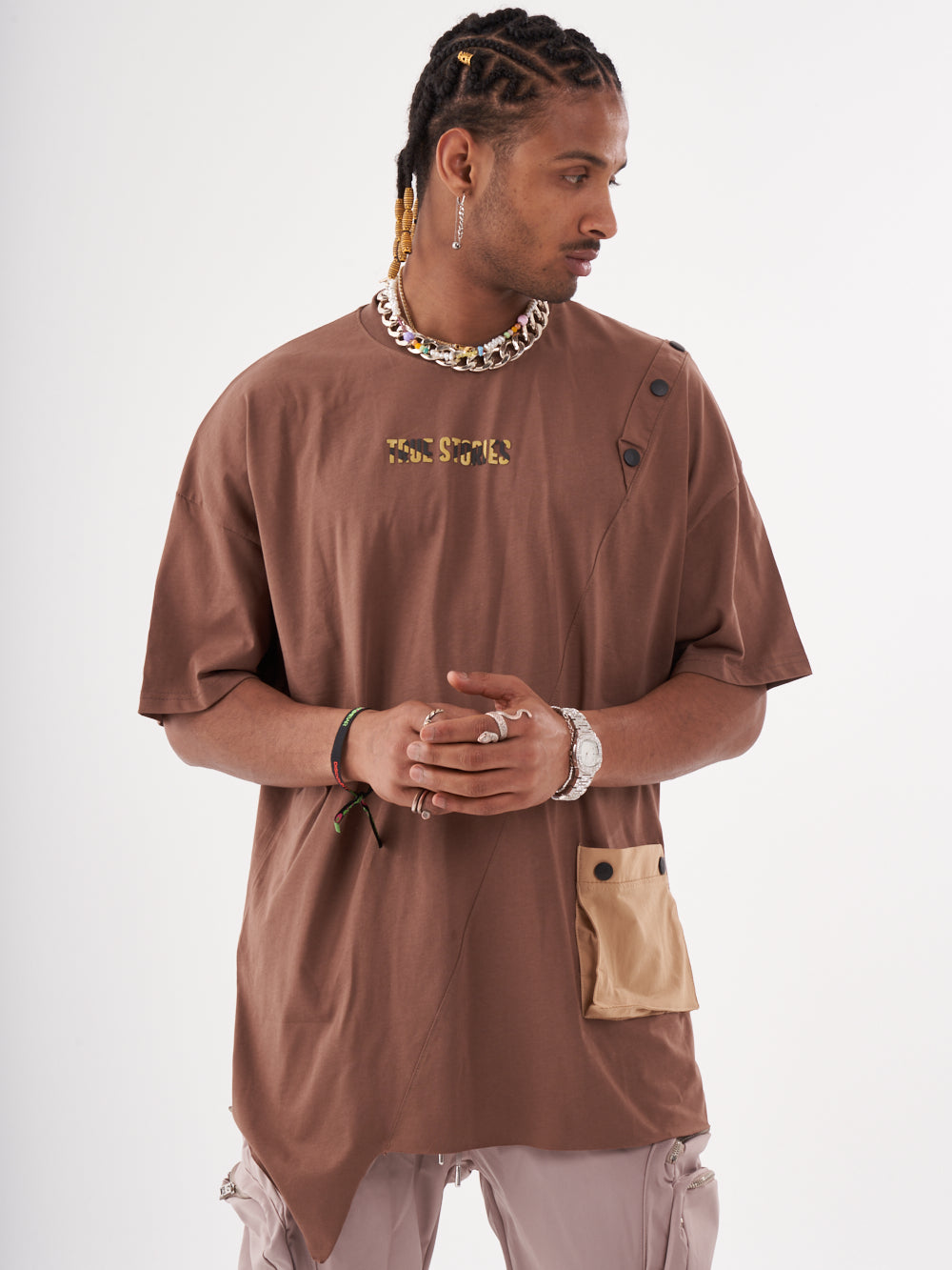 A man wearing a BEATNIK T-SHIRT and cargo pants.
