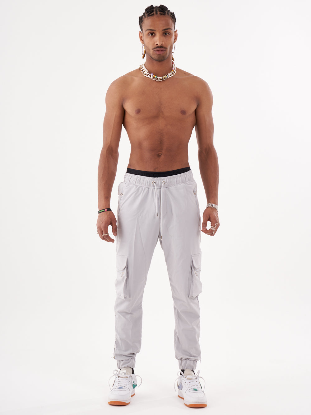 A man wearing ANARCHY JOGGERS and a tank top.