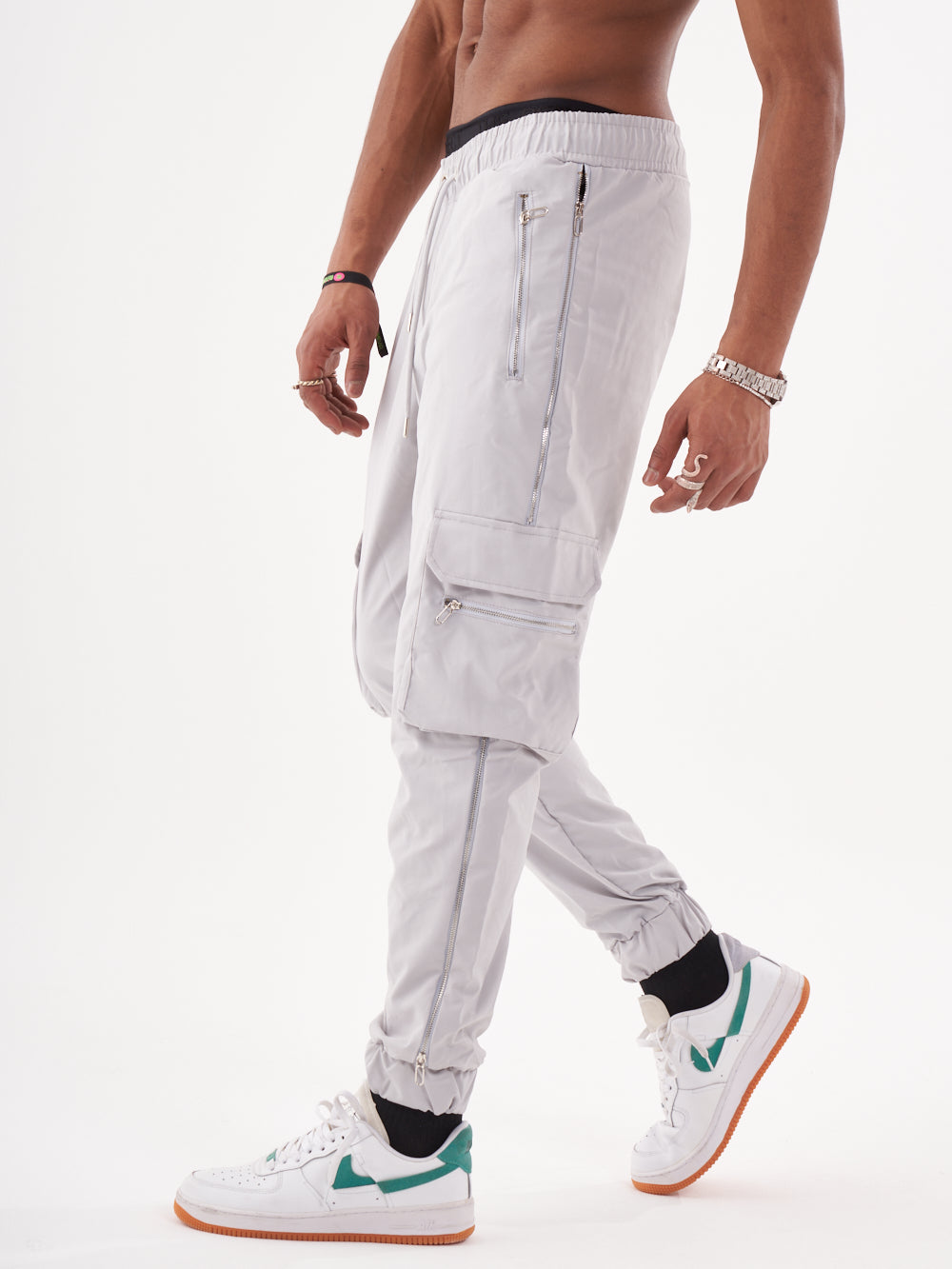 A man in a pair of ANARCHY JOGGERS is posing in front of a white background.