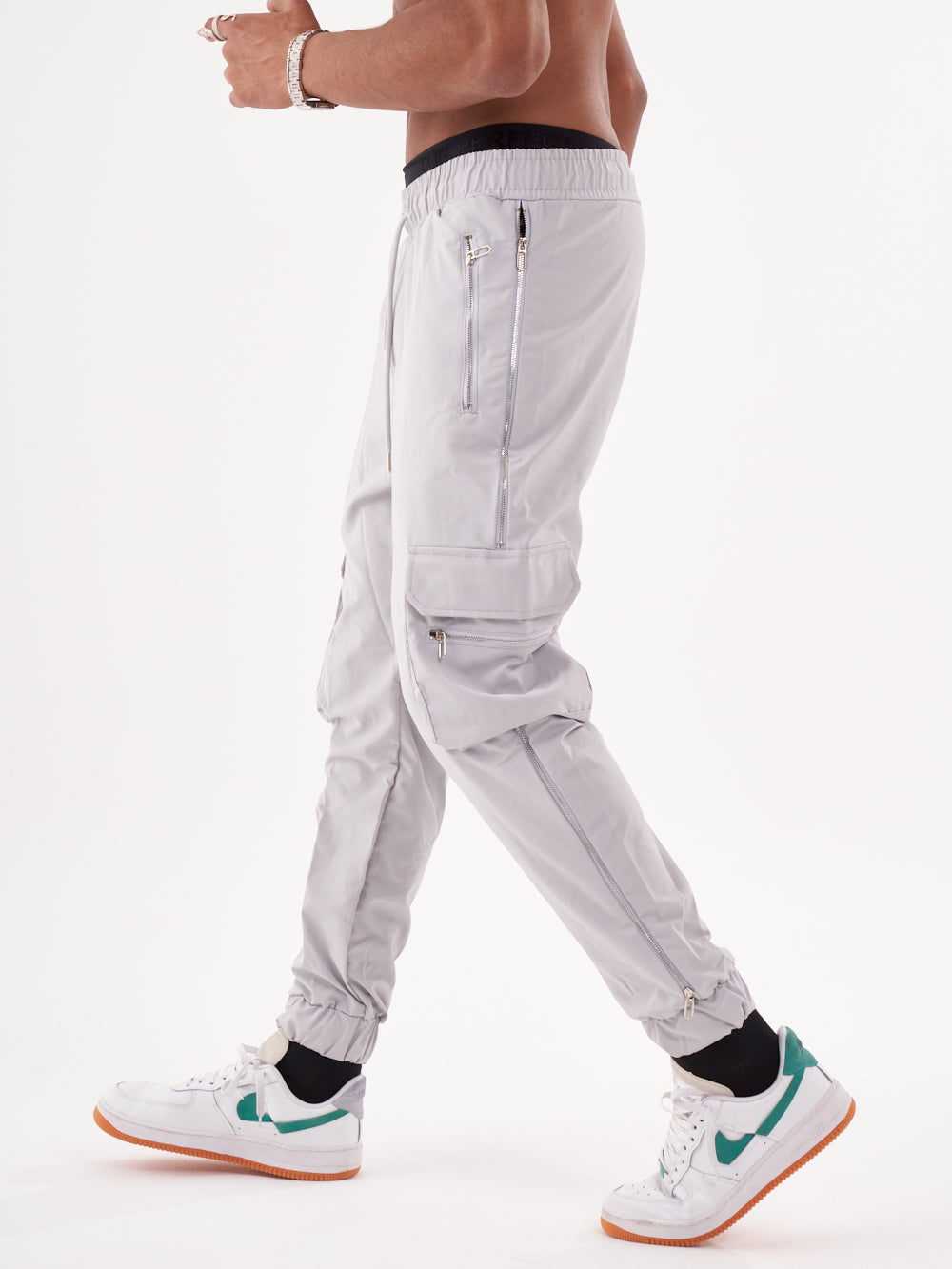 A man wearing ANARCHY JOGGERS and sneakers.