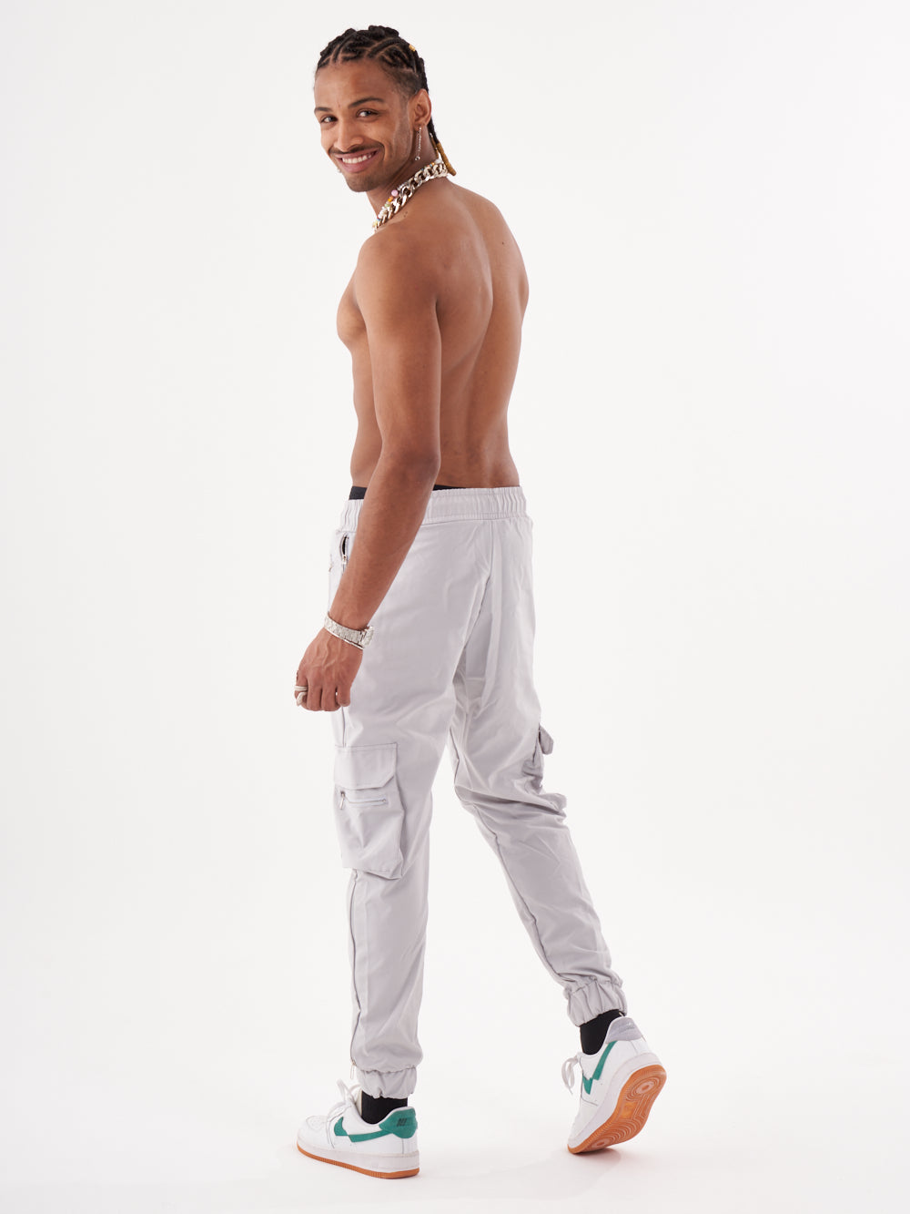 A man in ANARCHY JOGGERS standing with his back to the camera.
