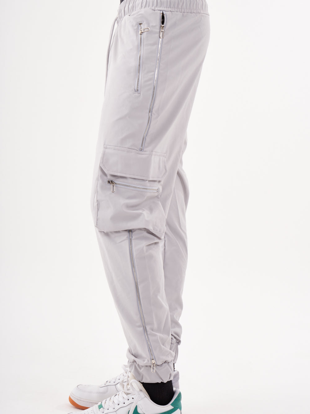 A man wearing ANARCHY JOGGERS and white sneakers.