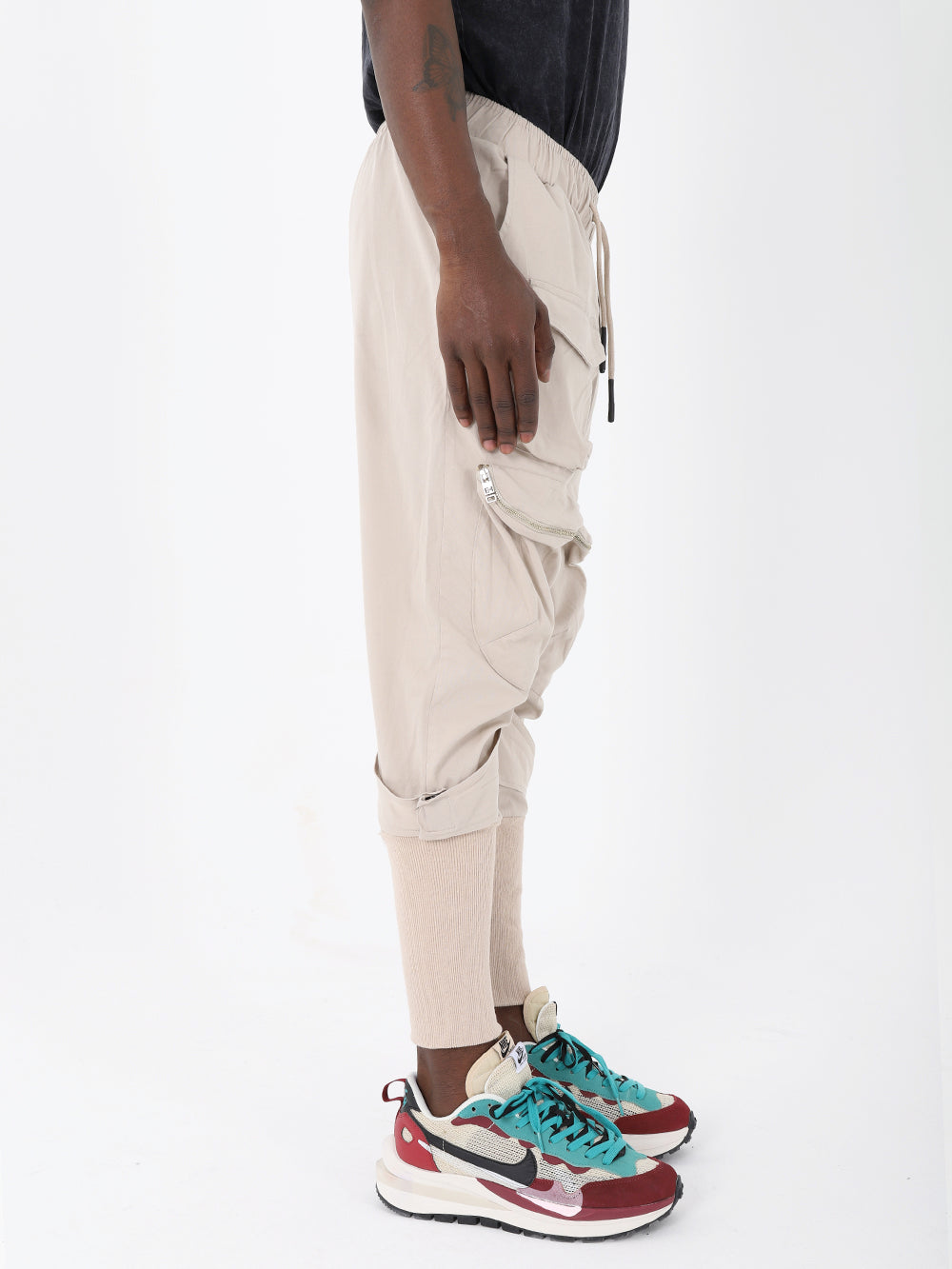 A man in Jupiter joggers and sneakers.