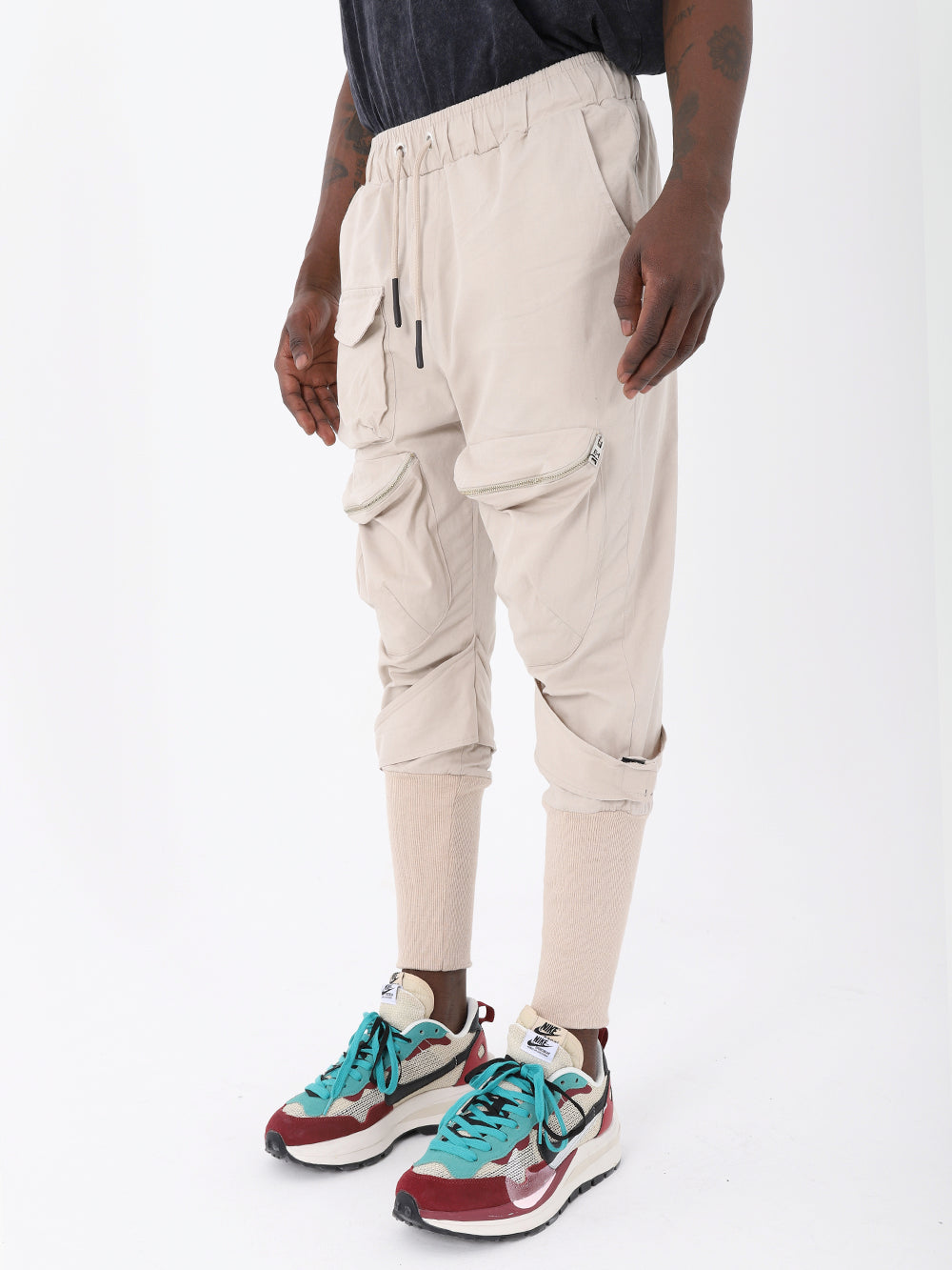 A man wearing JUPITER JOGGERS and sneakers.