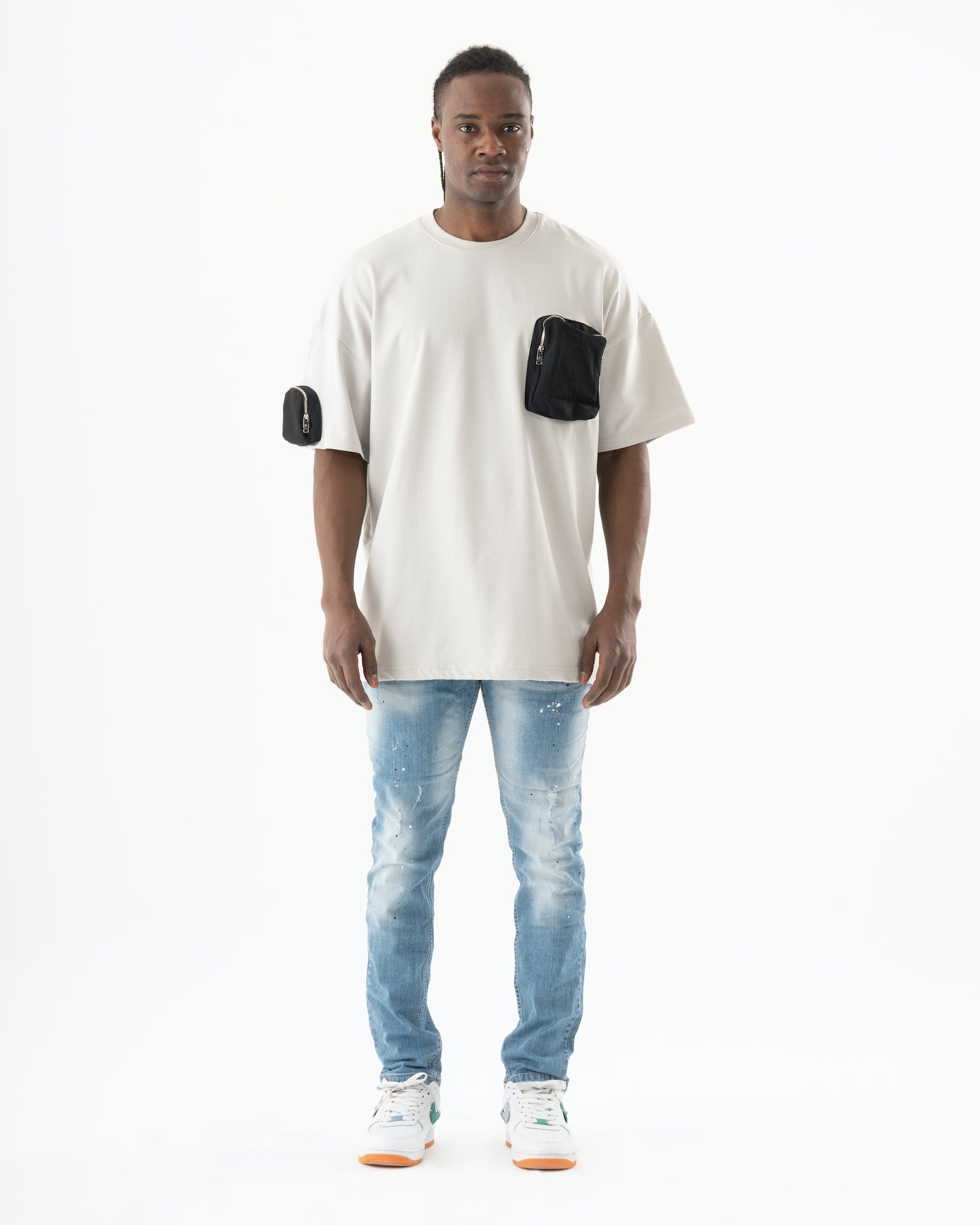 A man wearing SKATER jeans and a white t-shirt.