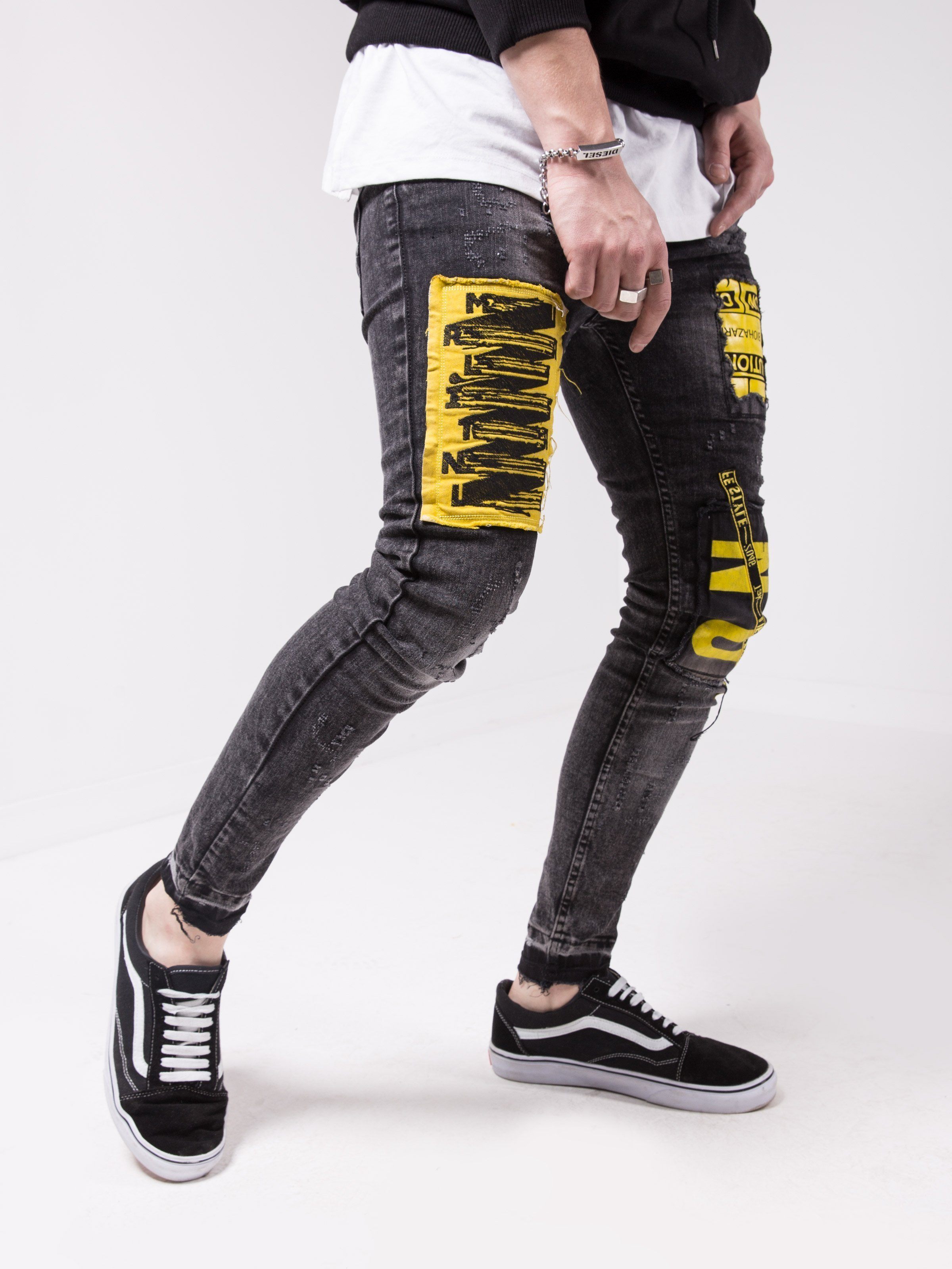 A man wearing a pair of MOUNT ONE with yellow stripes.