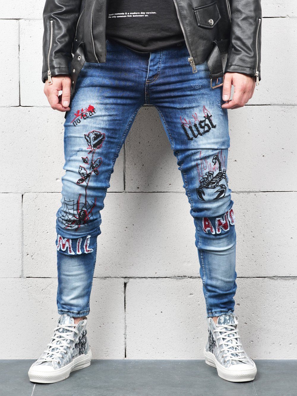 Lower body shot of a man wearing ROSE TATTOO skinny jeans