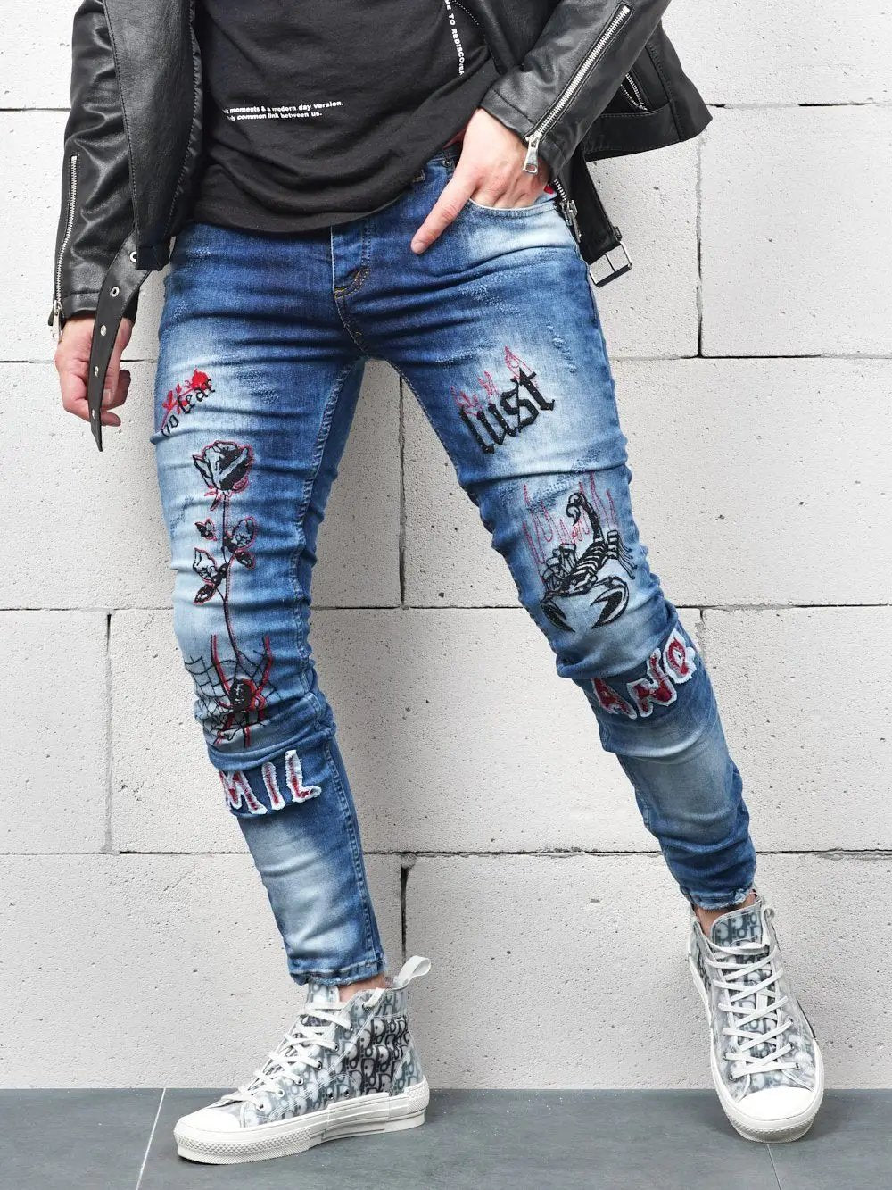 Lower body shot of a man wearing ROSE TATTOO skinny jeans
