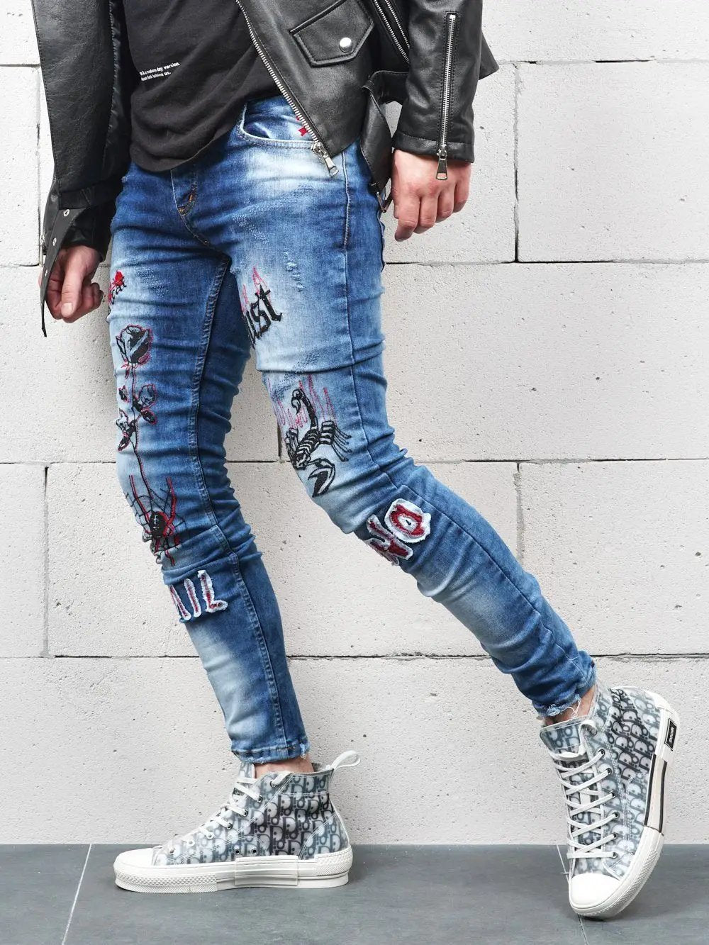 Lower body shot of a man wearing ROSE TATTOO skinny jeans