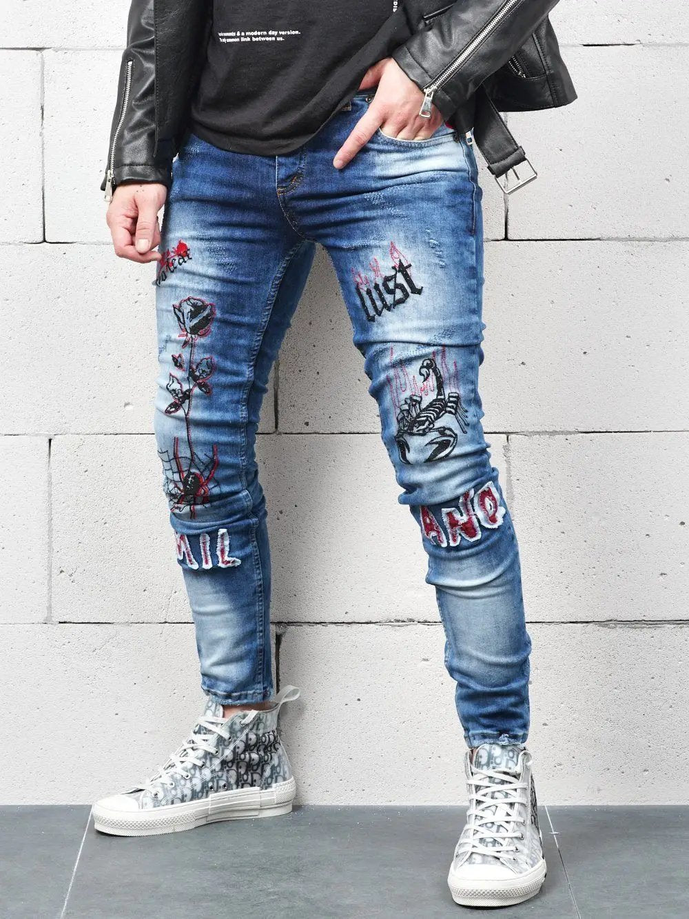 Lower body shot of a man wearing ROSE TATTOO skinny jeans