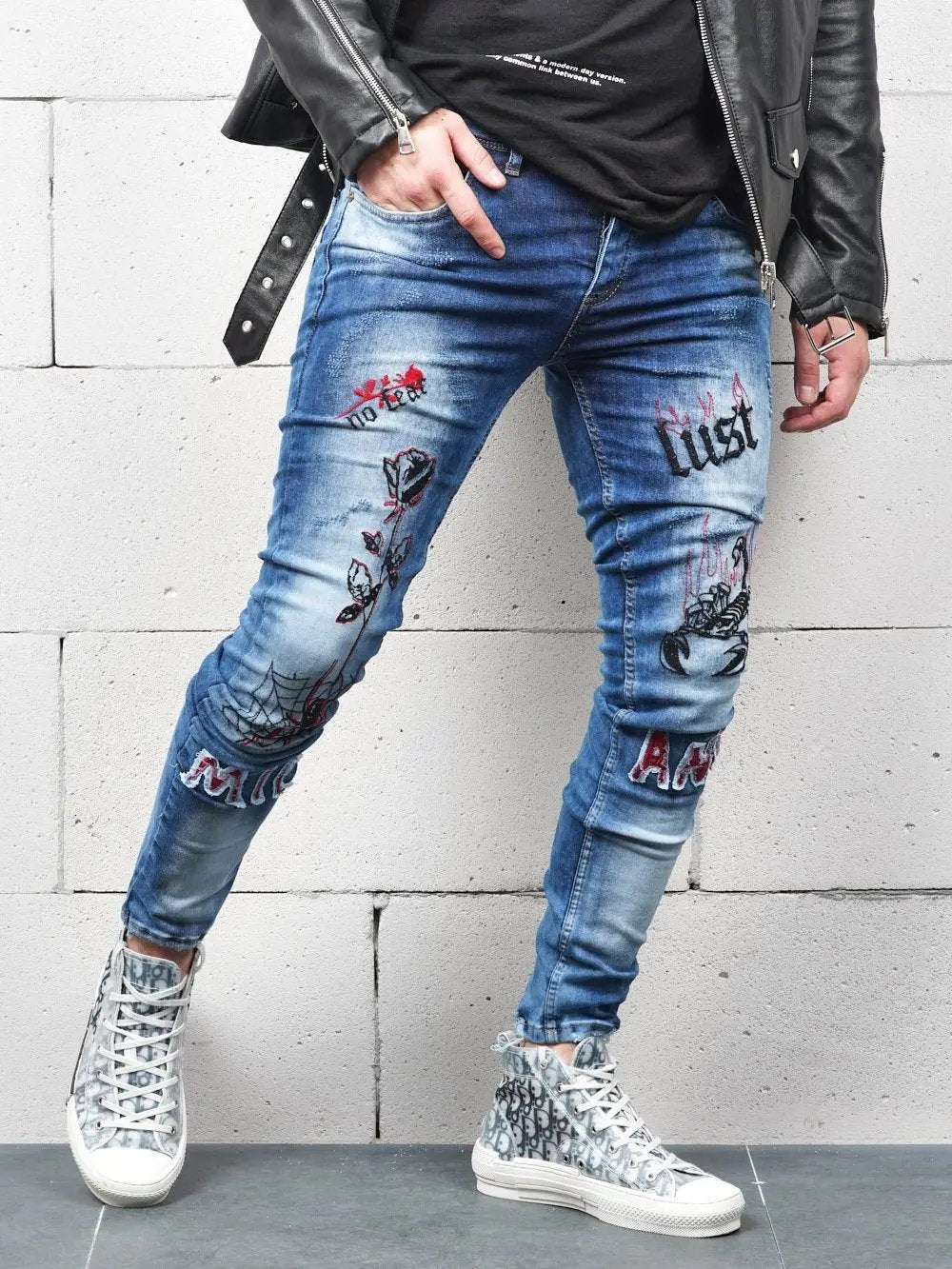 Lower body shot of a man wearing ROSE TATTOO skinny jeans 