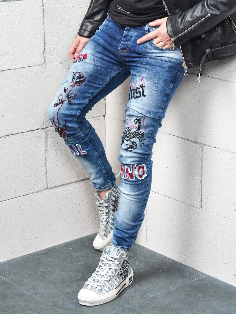 Lower body shot of a man wearing ROSE TATTOO skinny jeans