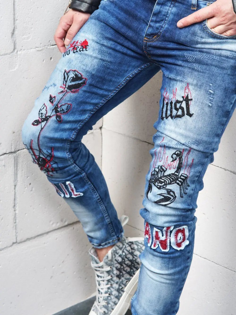Lower body shot of a man wearing ROSE TATTOO skinny jeans