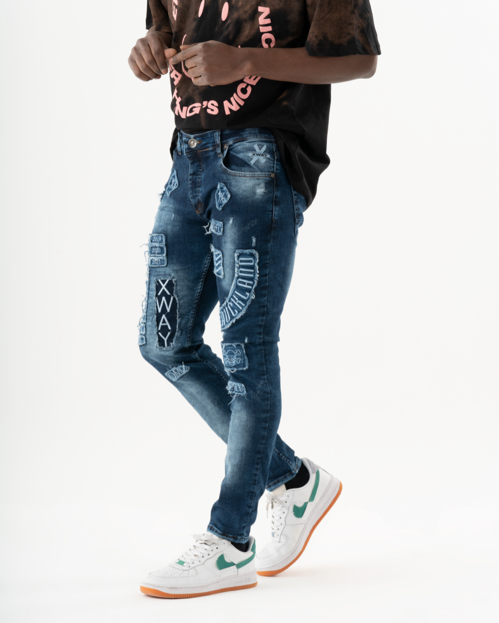 A man rocking INJUN | BLUE skinny fit jeans and a t-shirt.