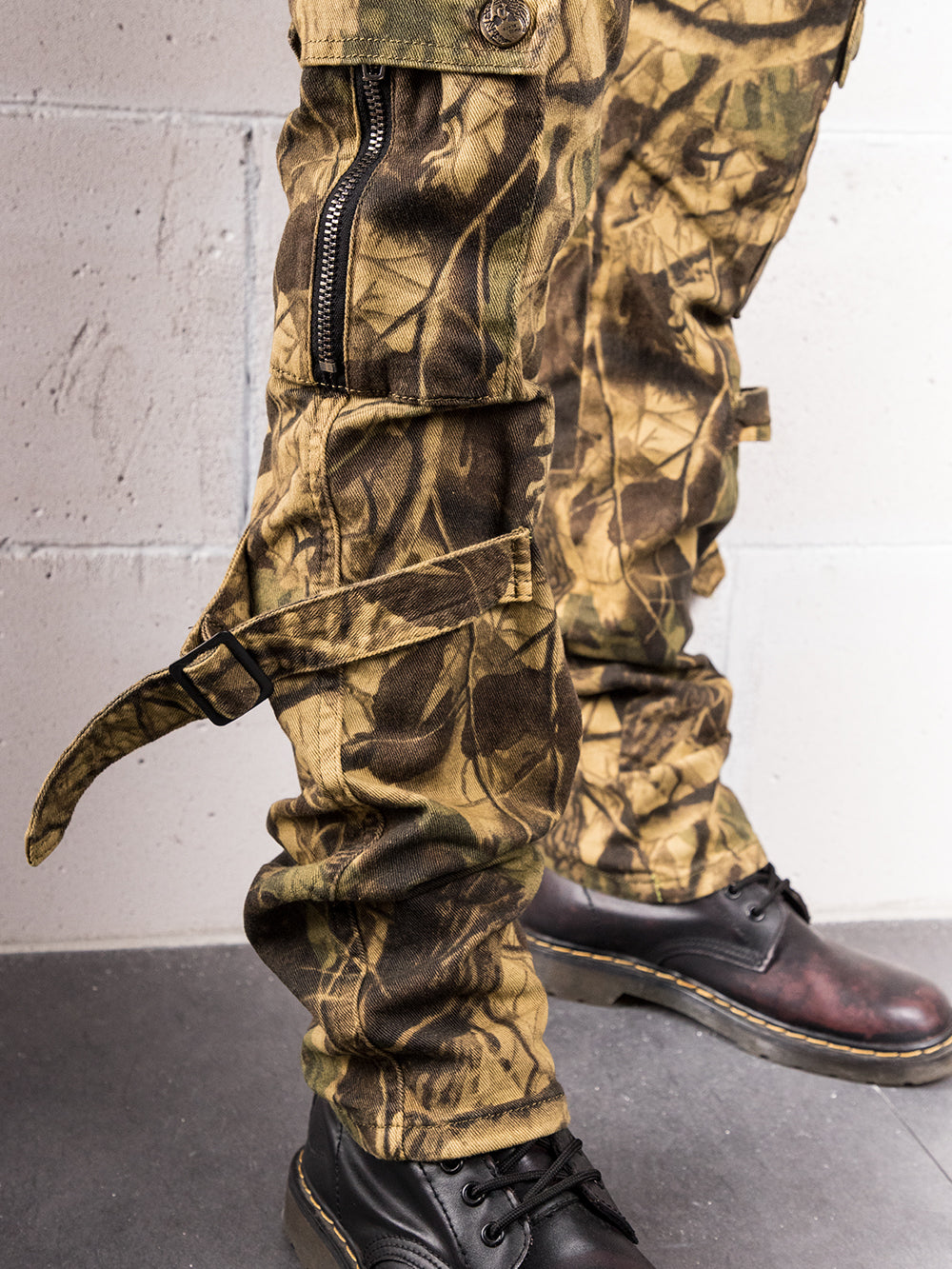 A man wearing AVATAR pants and boots.