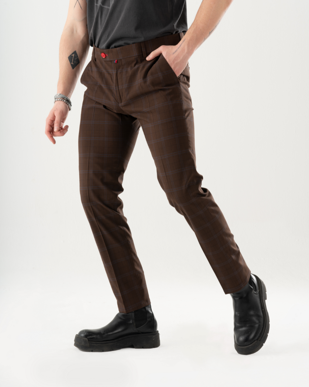 A man in High-Castle Pants is posing.