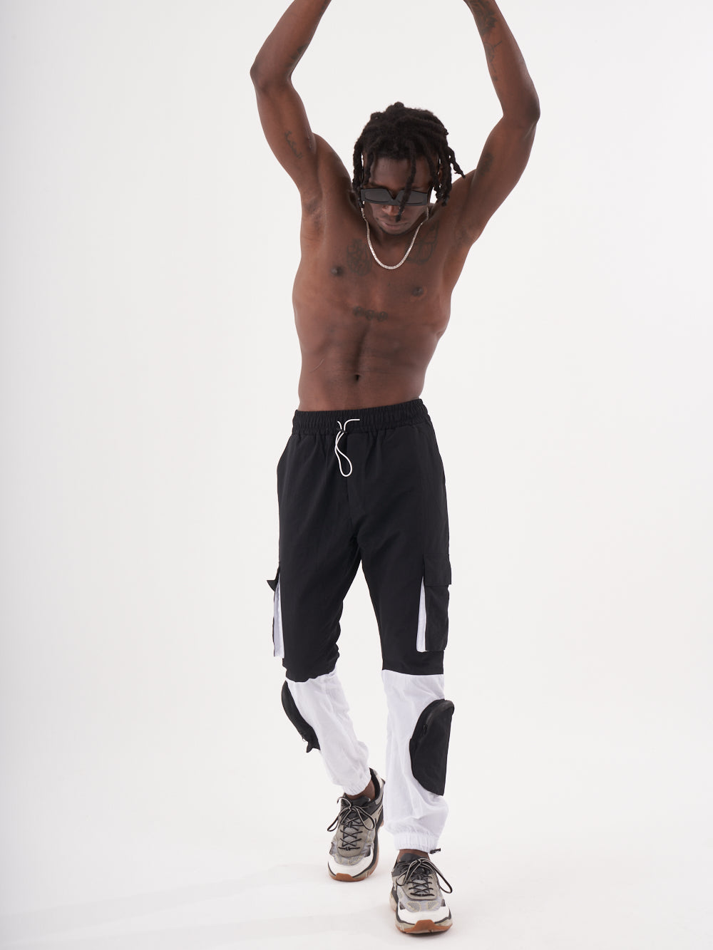 A man in RENEGADE | BLACK jogging pants.