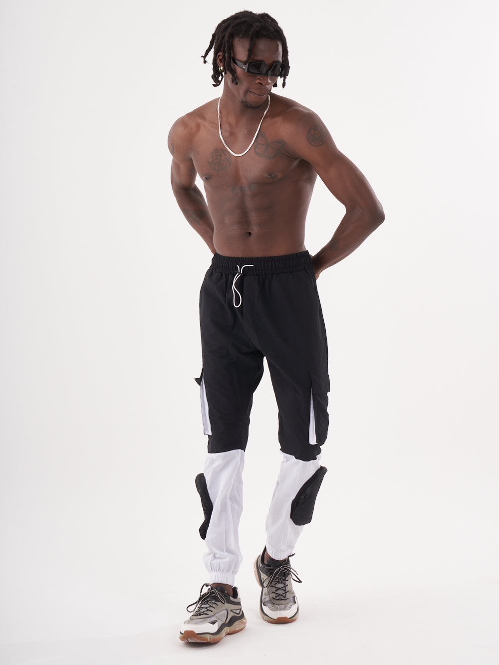 A man in RENEGADE | BLACK joggers posing for a photo.