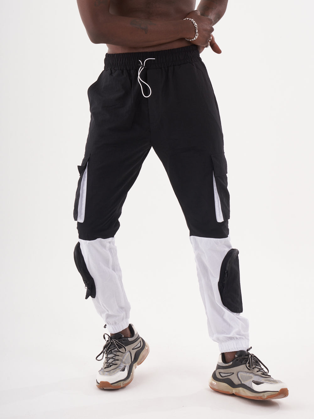 A man in RENEGADE | BLACK joggers posing for a photo.
