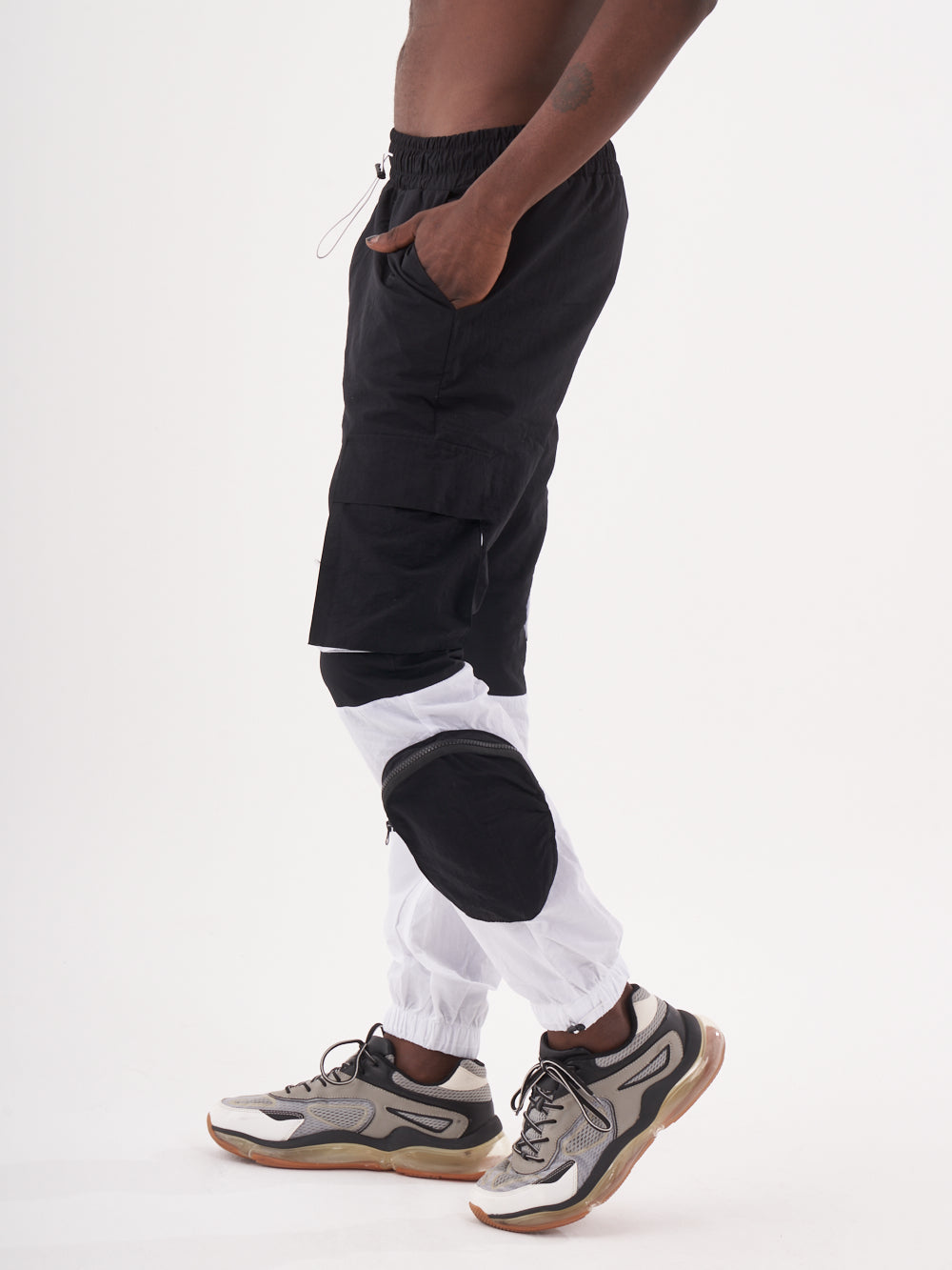A man wearing RENEGADE | BLACK jogger pants.
