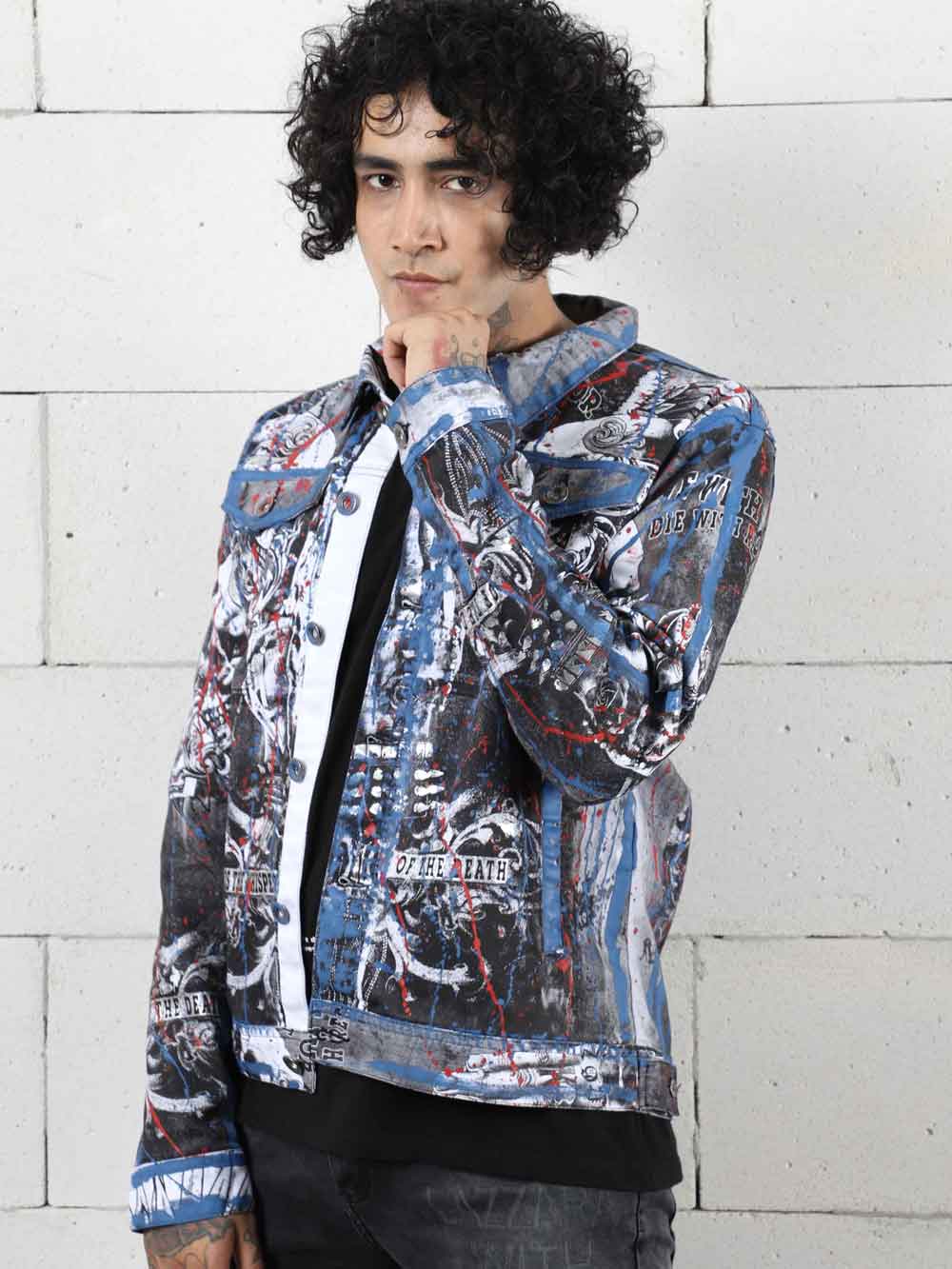 A man wearing a LA VIDA LOCA denim jacket.