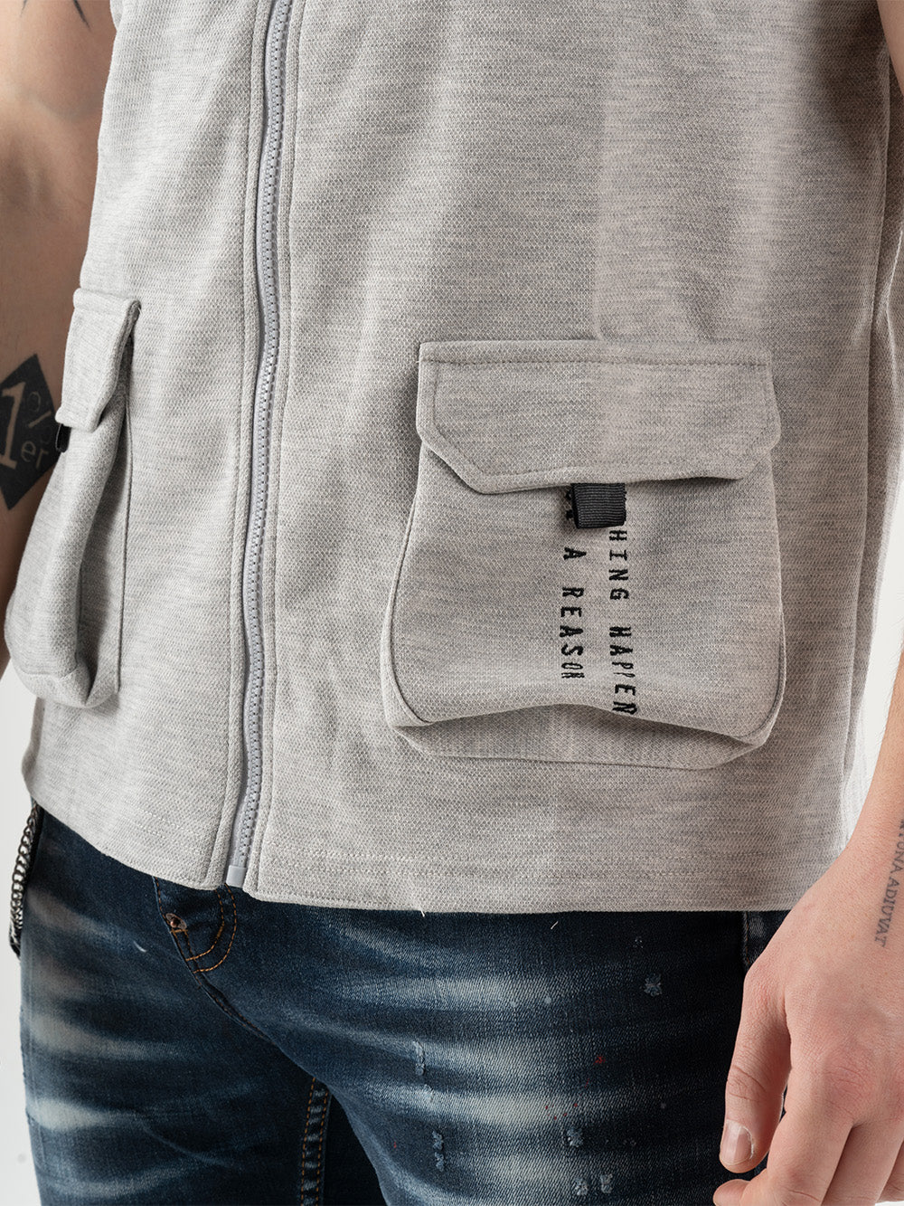 A man wearing a FREESPIRIT VEST with cargo pockets on the back.