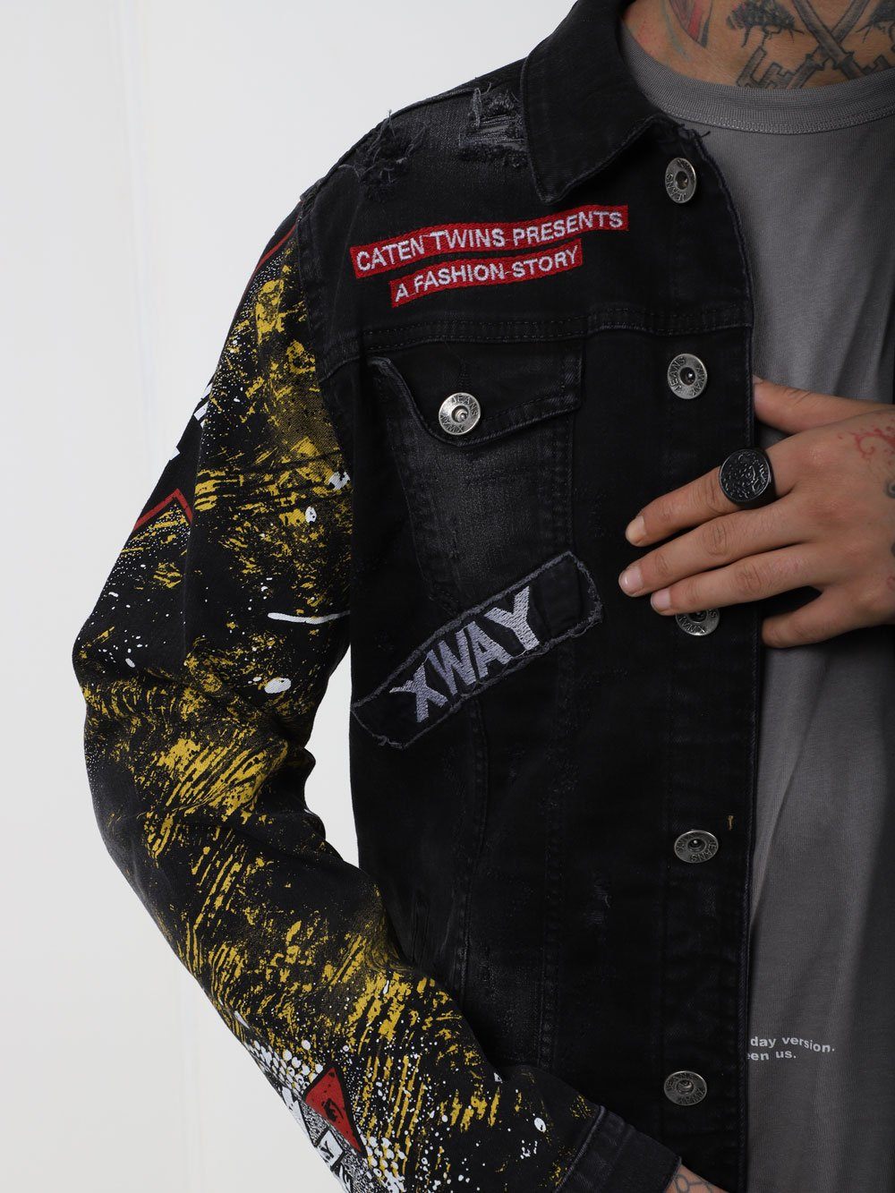 Close up shot of a man wearing THE CAPTAIN Denim Jacket by SERNES