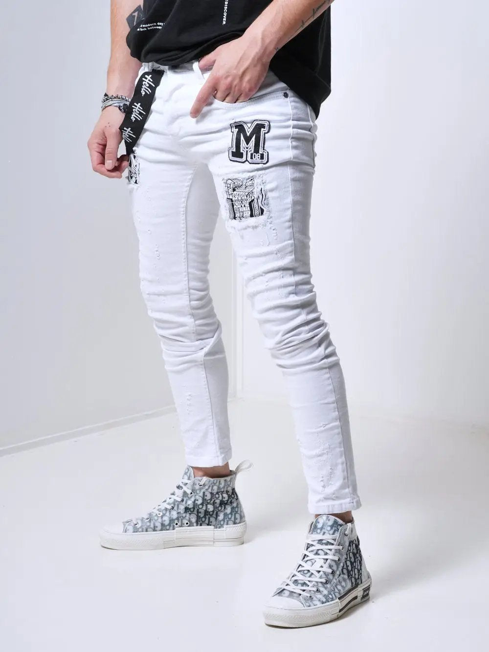 A man wearing MASSIVE skinny fit white jeans.