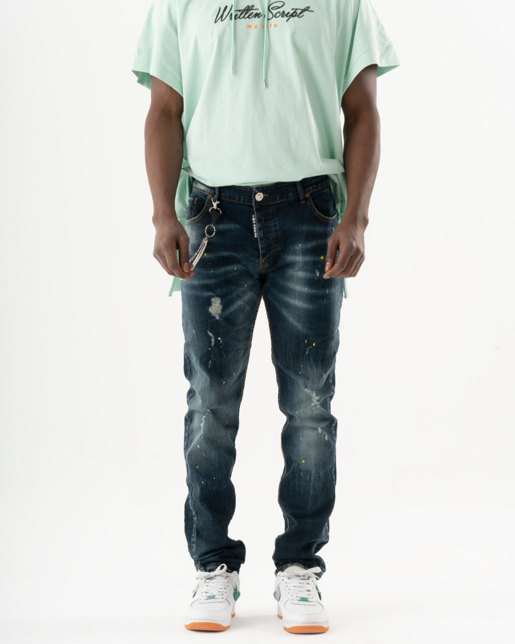 A man wearing KUDOS jeans.