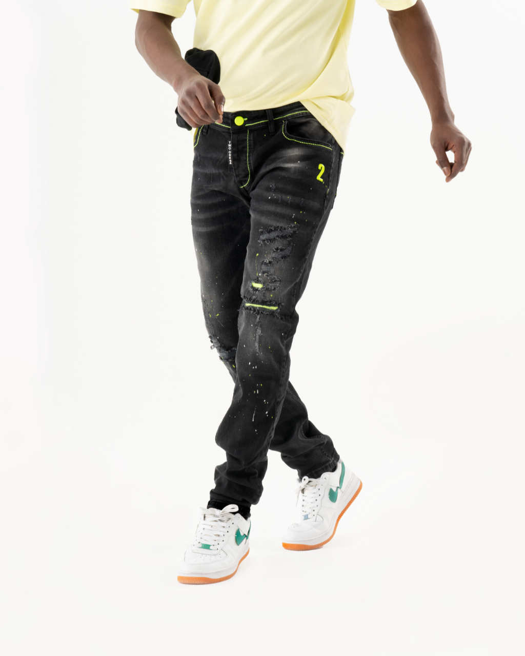 A man wearing ripped skinny black TWILIGHT jeans.