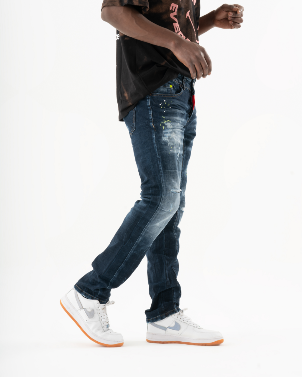 A man wearing INCOGNITO jeans.