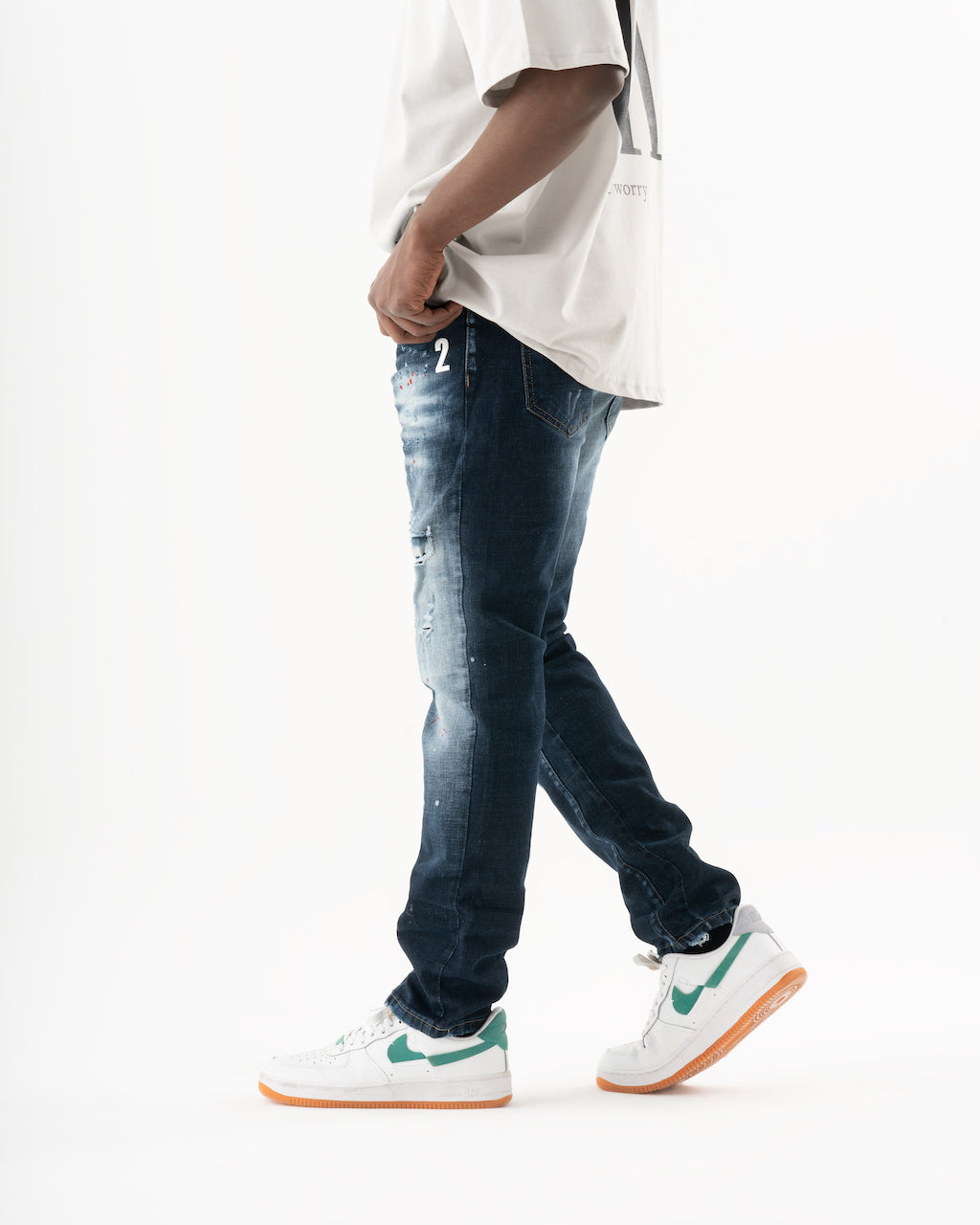 A man wearing a STARLIGHT t-shirt and jeans.