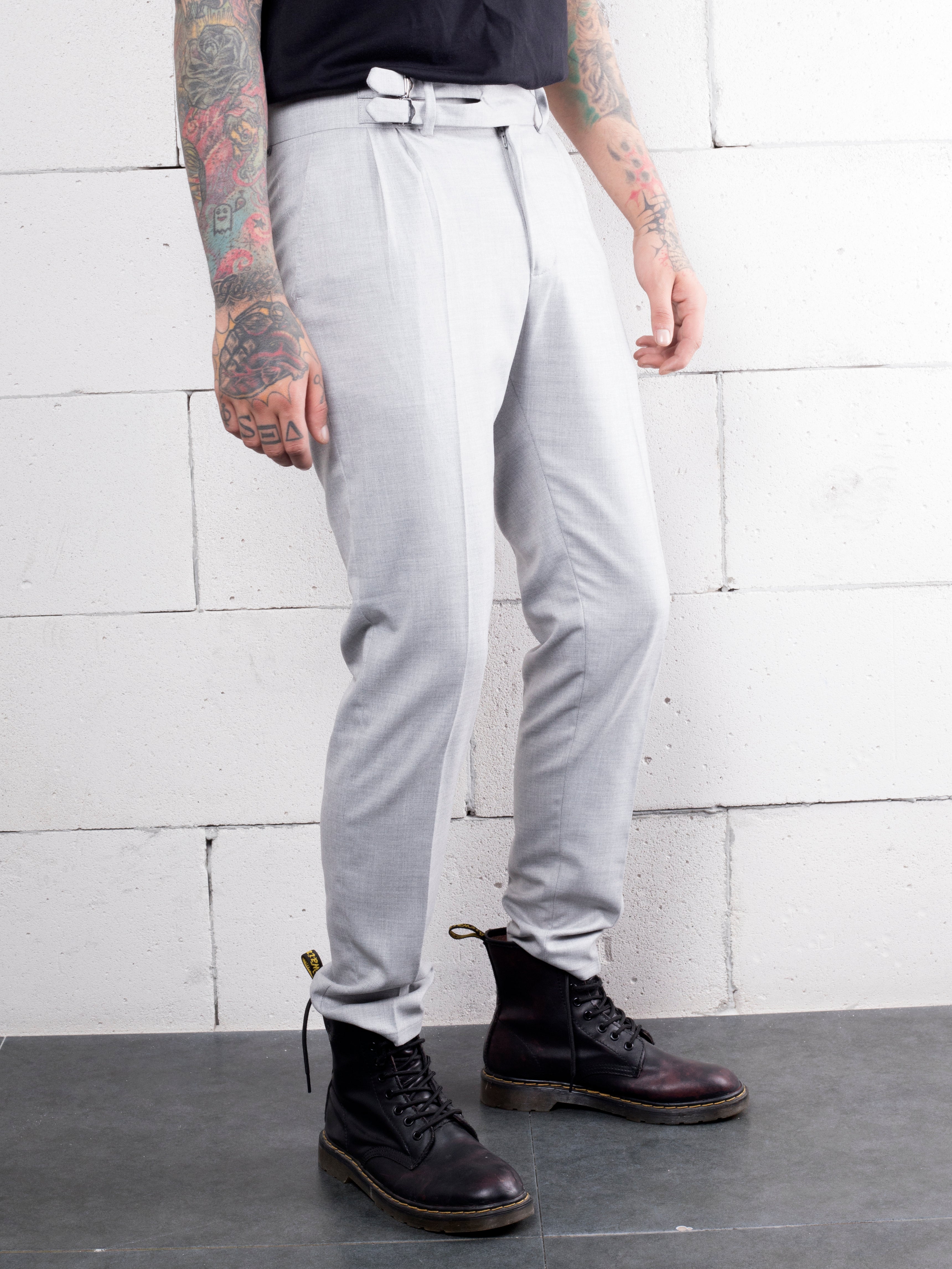 A man with tattoos wearing GRANITE PANTS.