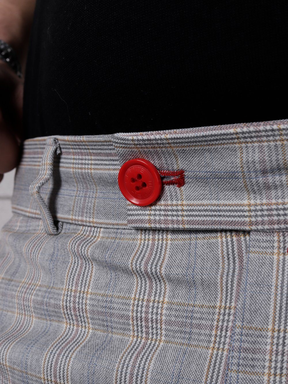 Close up shot of the waist button in front of VANILLA LATTE Striped Pants by SERNES