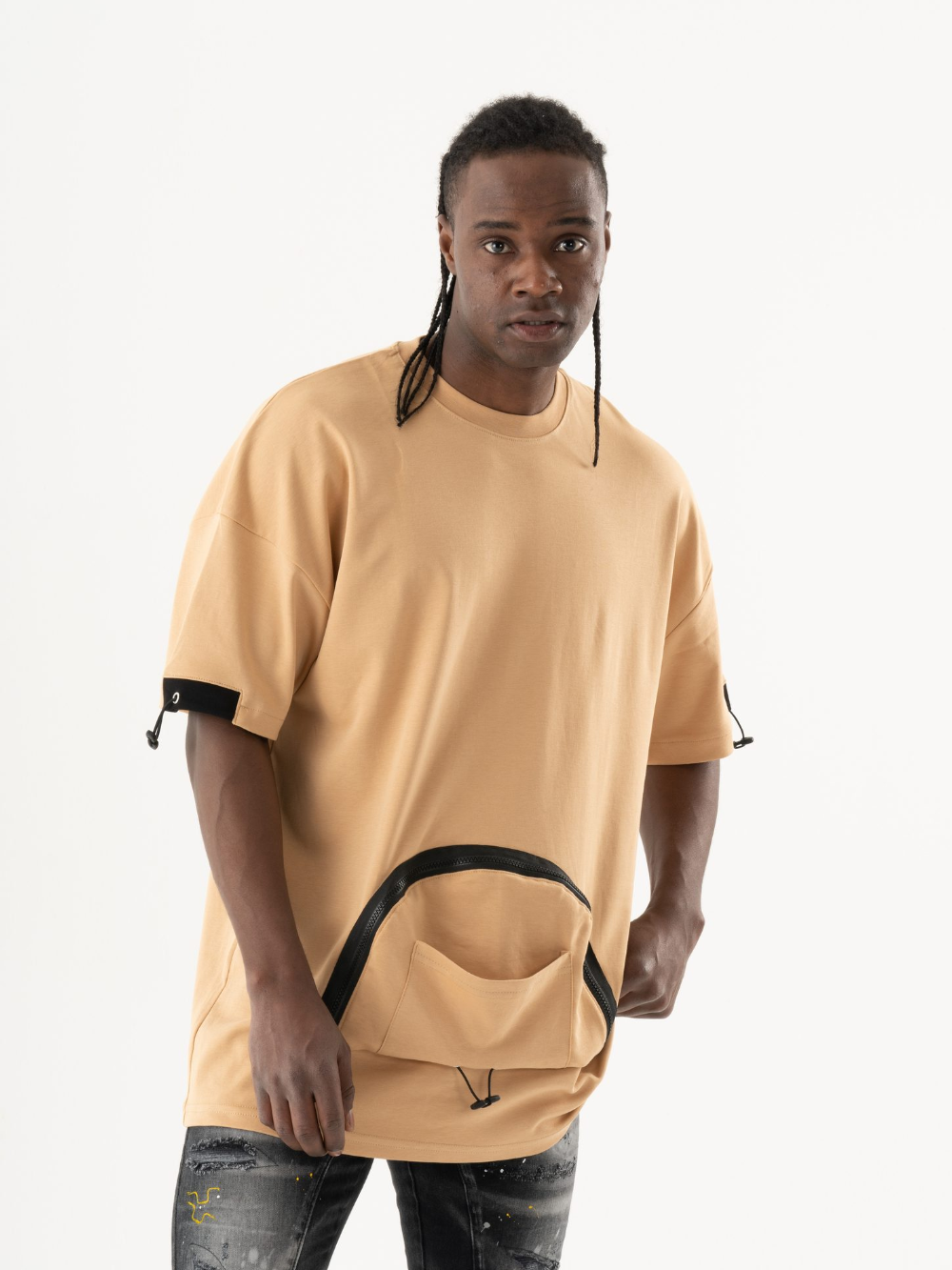 A man wearing a MOSCO T-SHIRT and jeans.