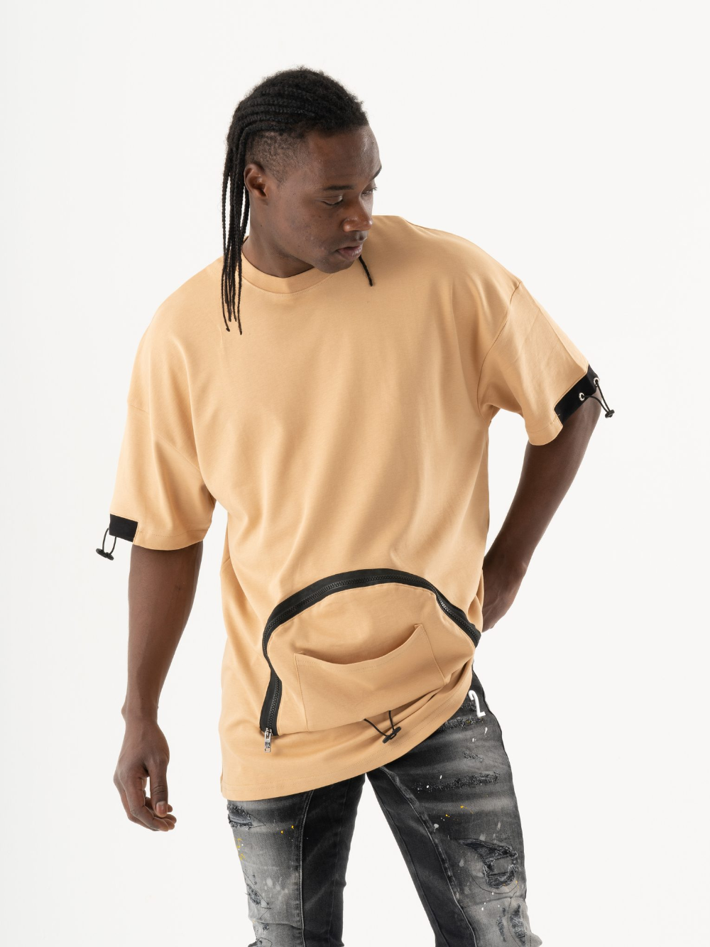 A man wearing a MOSCO t - shirt and jeans.