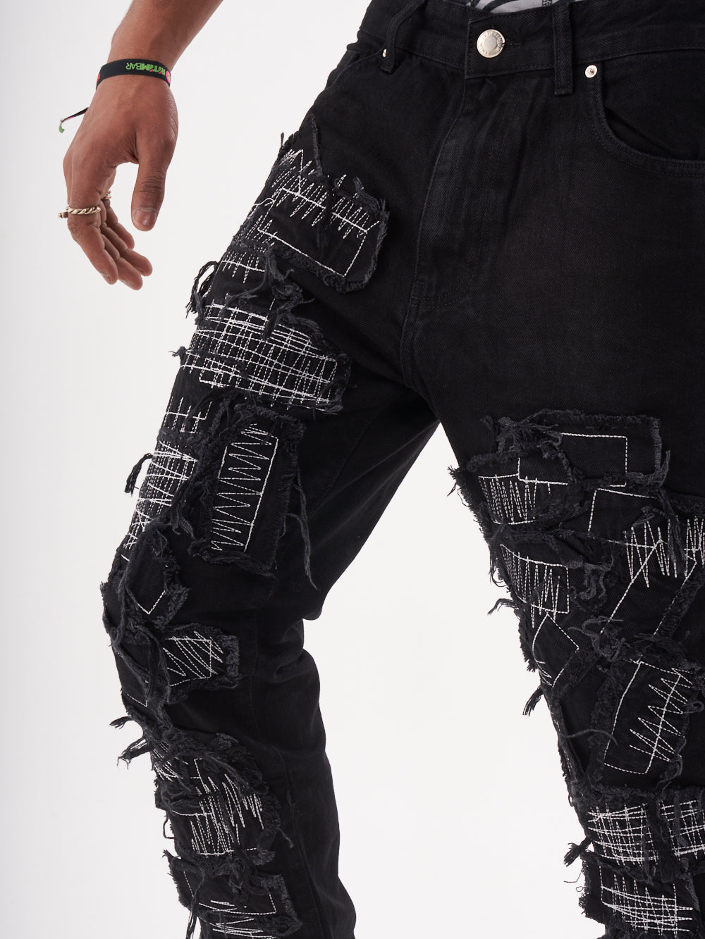 Lower body shot of a man in a black color BLUEPRINT streetwear jeans by SERNES