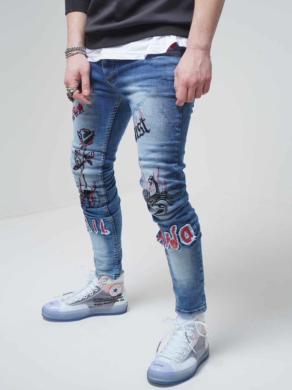Lower body shot of a man wearing ROSE TATTOO skinny jeans
