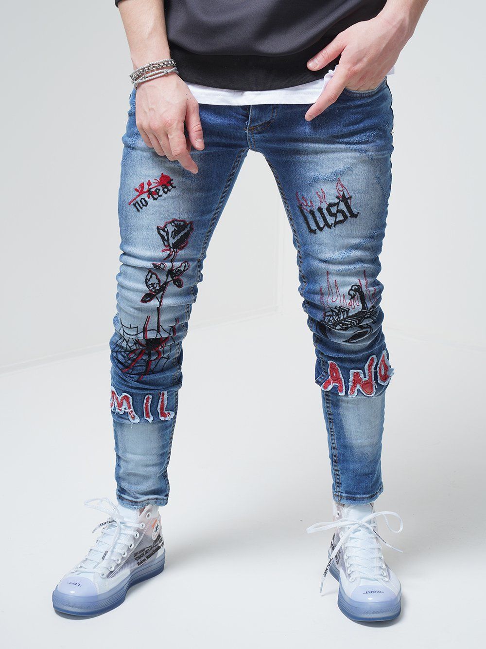 Lower body shot of a man wearing ROSE TATTOO skinny jeans 