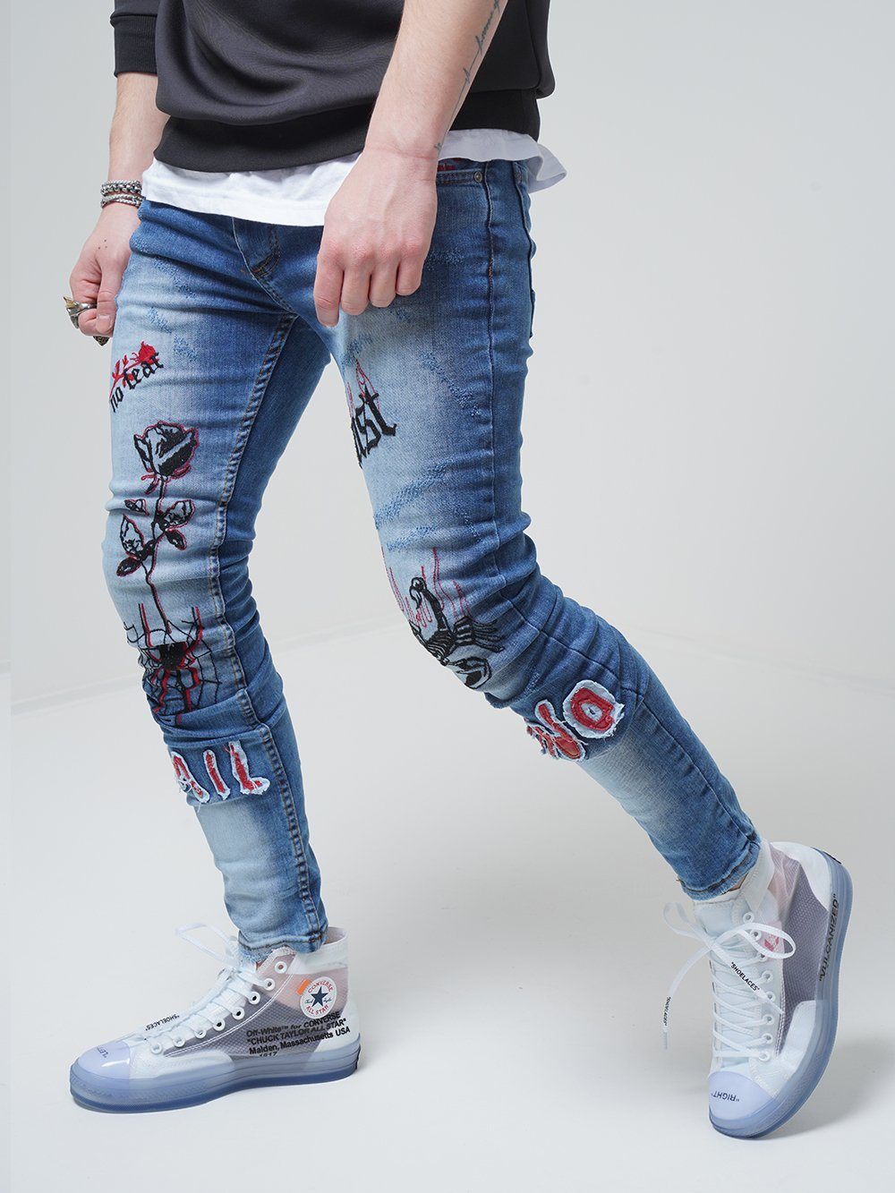 Lower body shot of a man wearing ROSE TATTOO skinny jeans 